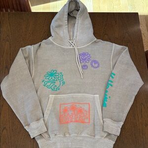 Tan Hoodie with Colorful Graphic Accents